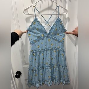 Floral blue dress. Zipper works great. Adjustable straps. Cris cross back straps